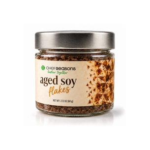 Jar of Chef Seasons Aged Soy Flakes beside a plated dish
