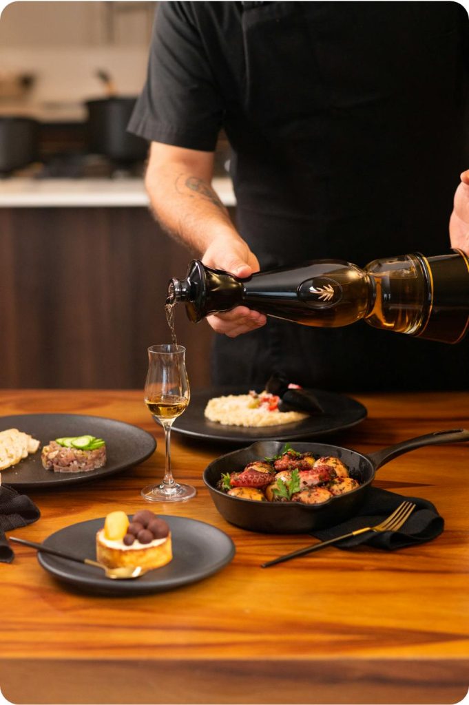 Clase Azul Gold being poured alongside a meal