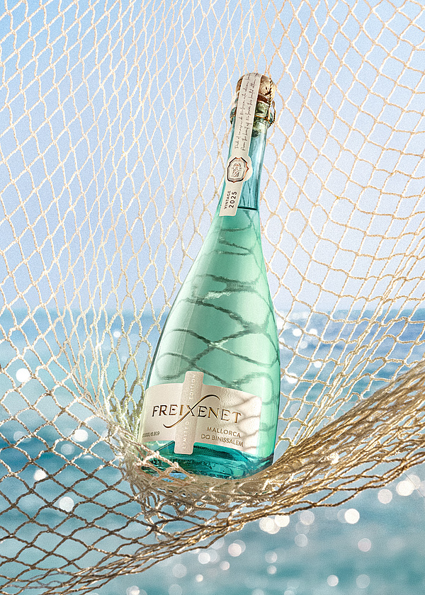 Freixenet Mallorca Limited Edition bottle overlooking the Mallorcan coast