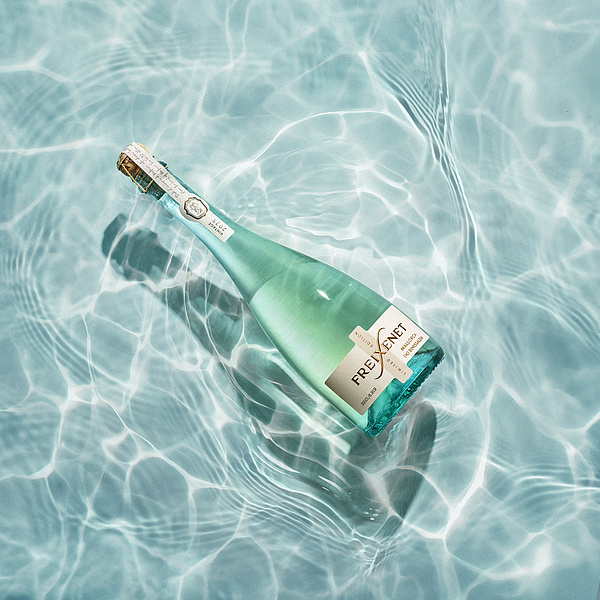 Freixenet Mallorca Limited Edition bottle in clear Mediterranean water