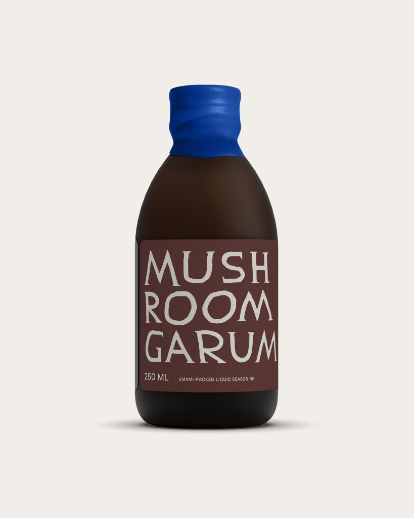 Noma Projects Mushroom Garum bottle on a red background